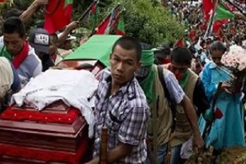 Hundreds of Indigenous people accompany the coffin of Daniel Coicue, a member of the Indigenous Nasa tribe