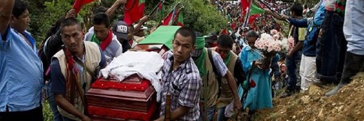 Hundreds of Indigenous people accompany the coffin of Daniel Coicue, a member of the Indigenous Nasa tribe